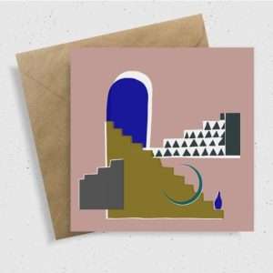 card with a blue arch with green steps leading down with a half moon and black and white geometric pattern